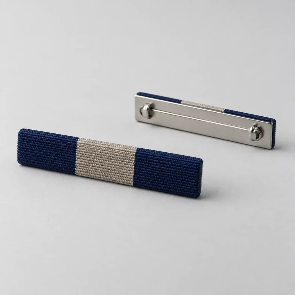 Navy-and-stone fabric ribbon bar with a separate mounting-back reference.
